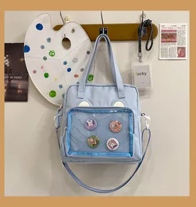 Cute blue ita bag with transparent pin display window, cute bear ears and shoulder strap.