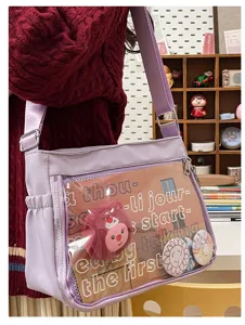 Light purple canvas messenger ita bag with clear window, anime badges and cute plush charm.