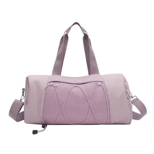 Lightweight purple gym duffle bag with mesh front pocket and comfortable shoulder strap.