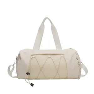 Lightweight sports gym duffel bag with large capacity, mesh front pocket and comfortable handles.