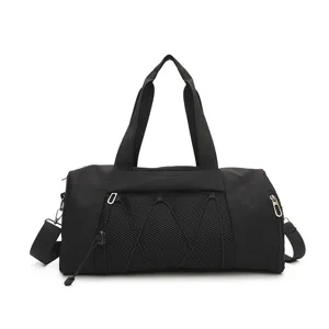 Black sports gym bag detail view, showing durable fabric, mesh front pocket, and sturdy zippers.