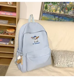 Light blue canvas school backpack with cute puppy embroidery, large capacity casual daypack.