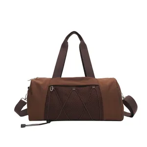 Brown gym duffel bag detail, large capacity sports yoga travel bag with mesh pocket.