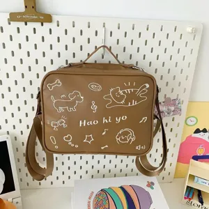 Detailed view of brown cute cat embroidered ita bag, dual-use backpack and messenger bag.