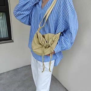 Casual nylon crossbody bag with drawstring closure, large capacity dumpling bag for daily use.