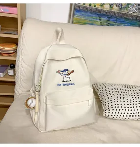 Detailed view of the white canvas backpack featuring cute puppy embroidery and casual style.