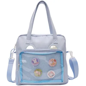 Light blue ita bag detail, transparent front pocket with cute badges, large capacity.