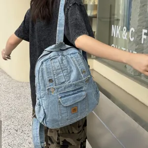 Vintage denim backpack for women, casual college style, stylish school bag for travel and daily commute.