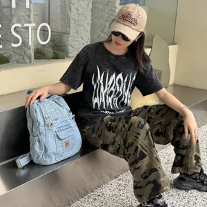 Vintage light blue denim backpack with front pockets, stylish casual daypack for daily commute.