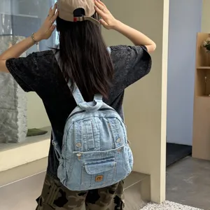 Vintage washed denim backpack for women, casual college style commuter travel bag