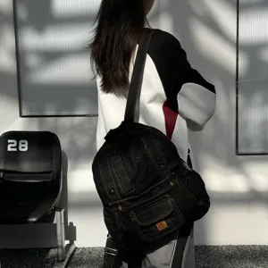 Dark denim backpack with retro design, perfect for student daily commute and travel style.
