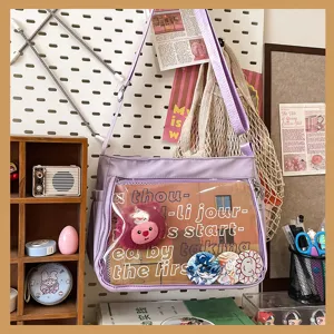 Light purple ita bag with a clear window, anime badges and plush charm for women.