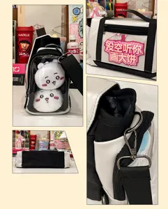 Detailed view of ACGN clear window ita shoulder bag, black and white design with cute plush dolls.