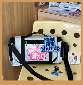 Ita bag detail showing transparent front pocket and funny slogan badges for daily use and anime fans.
