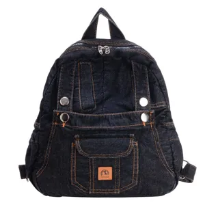 Dark denim backpack detailed view, vintage casual school bag with metal buttons and pockets.