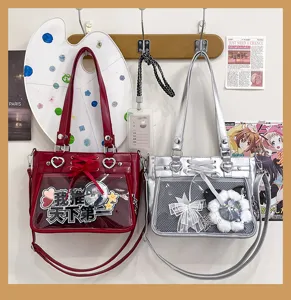 Moderna kai polyxrhsth diafanes tsanta omou PU me diakosmhtikh korandela Ita bag