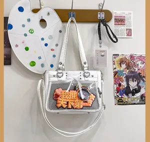 Λευκή τσάντα χιαστί ita bag από PU δέρμα με φιόγκο κορδέλας και διαφανές παράθυρο.