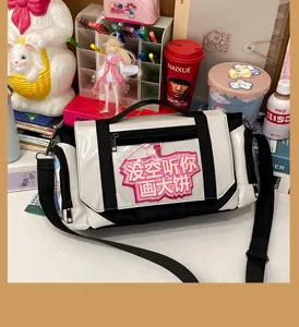Casual canvas ita shoulder bag with transparent front pocket and funny text for students daily use.