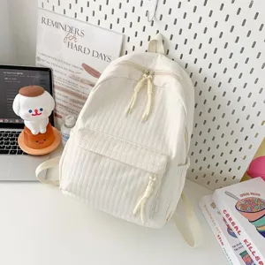 Sac à dos d'école en toile écru décontracté, vue détaillée avec poche avant et zips.