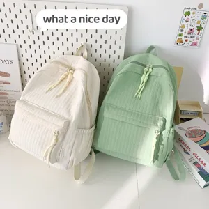 Grand sac à dos de toile pour étudiant, cartable double épaule tendance pour le voyage.