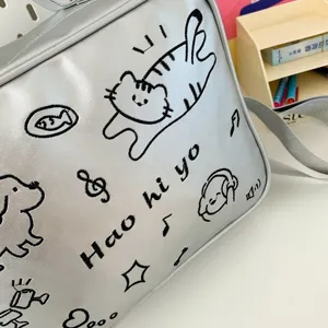 Silver metallic ita shoulder bag with cute embroidered cat design, perfect for anime fans.