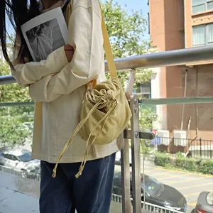 Casual nylon drawstring shoulder bag for daily use, stylish street style dumpling crossbody bag.