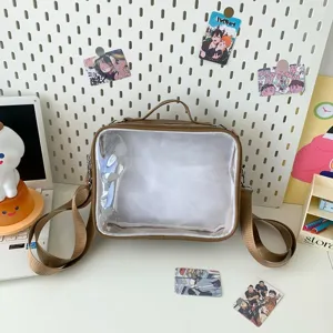 Brown clear window ita bag detail view, cute college style messenger bag for anime pins.