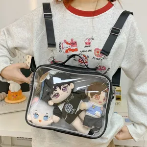 Clear 20cm plush doll ita bag detail showing transparent window and adjustable black straps.