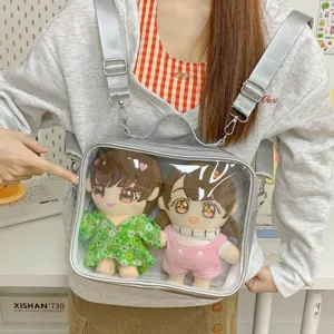 Clear front ita backpack for 20cm cotton dolls, stylish silver shoulder bag for anime fans.
