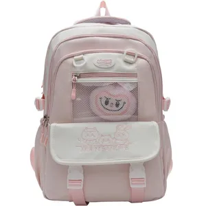 Rosa ästhetischer süßer Schulrucksack mit Netztasche und süßen Cartoon Stickerei Details.
