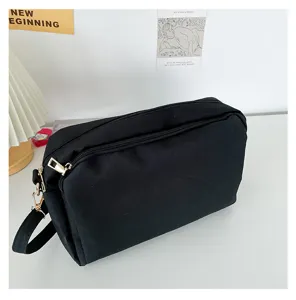 Black canvas crossbody bag minimalist casual daily shoulder bag with dual secure zippers.