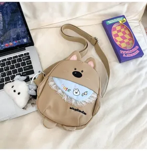 Joli sac bandoulière en toile pour chien avec bavoir mignon et pendentif en peluche pour tous les jours.