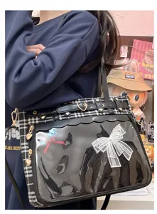 Detail shot of Japanese JK plaid ita bag with clear window, cute bow and heart buckle.