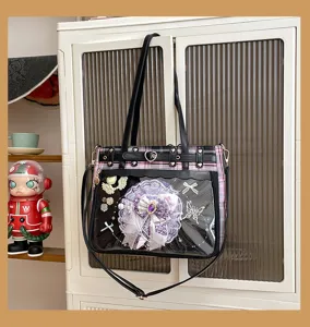Detailed view of Japanese style black and pink plaid ita bag with clear window and strap.