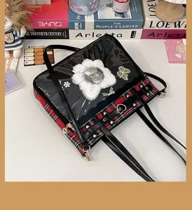 Japanese JK plaid ita bag detail view, showing clear window and cute fluffy flower decor.