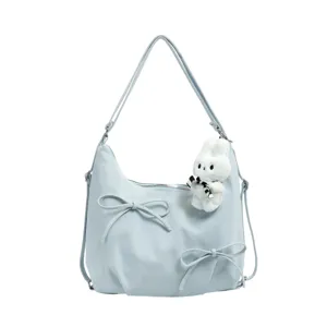 Light blue hobo shoulder bag with pleated cloud design, cute bows and plush rabbit charm.