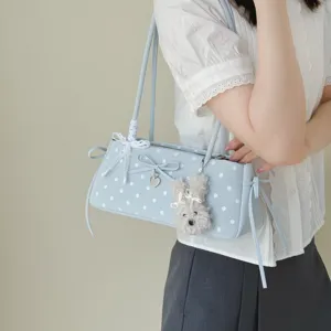 Chic Korean polka dot underarm shoulder bag with cute bow and plush charm for women.