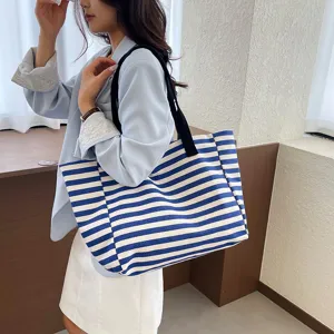 Casual striped canvas tote bag for women, large capacity shoulder bag for daily commute.