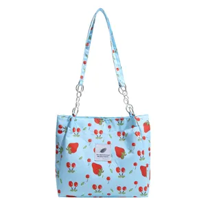Large capacity strawberry print tote bag for women, cute student commuter shoulder bag.