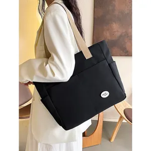 Large capacity black canvas tote bag for women, casual commuting shoulder bag with strap.
