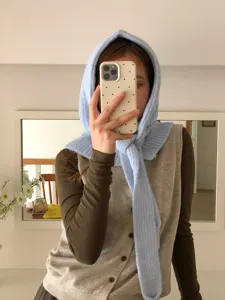 Detailed view of the stylish light blue knitted balaclava hood scarf combo for autumn.
