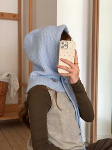 Blue knit balaclava hood detail showcasing soft ribbed texture and cozy winter design style