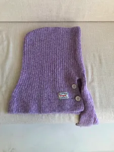 Detailed view of the purple wool knit balaclava hood scarf featuring stylish buttons and logo patch.