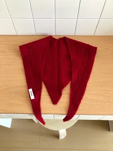 Red wool triangular scarf winter warm knitted shawl with cute bobble texture design.