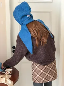Blue knitted balaclava wool hat detail, winter warm scarf integrated student fashion design.