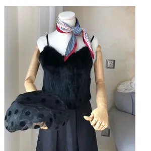 Detailed view of the stylish pleated square scarf and chic fuzzy camisole on display.