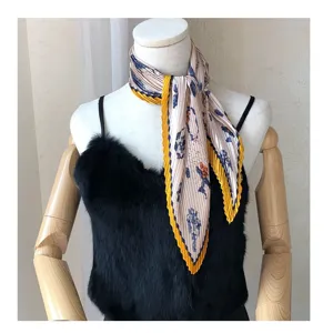 Detailed view of the pleated vintage square scarf showcasing fine neck styling and classic print.