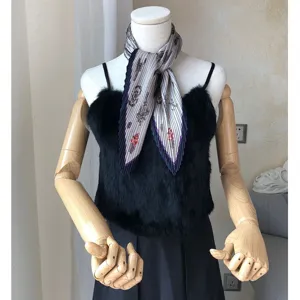 Detailed view of a pleated vintage neck scarf with elegant pattern styled on mannequin.