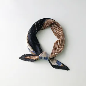 Detailed view of a stylish pleated neckerchief with color-block design, elegant and retro.
