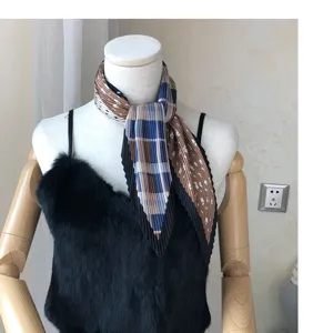 Detailed view of a retro pleated square scarf with color block plaid design for women.